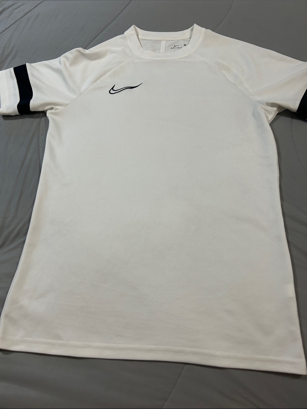 Nike White Short Sleeve Athletic Shirt with Black Sleeve Stripes